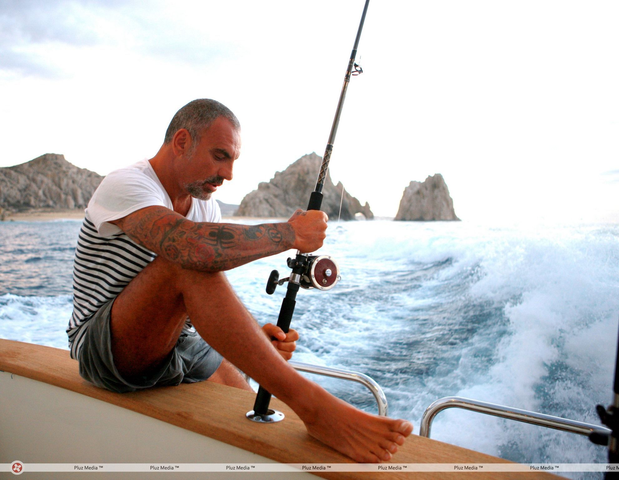 Christian Audigier catches a huge fish with his girlfriend Nathalie Sorensen | Picture 124255